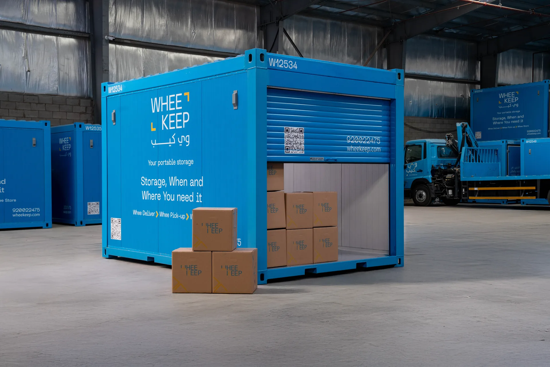 A WheeKeep roll-up-door unit with stock boxes in front