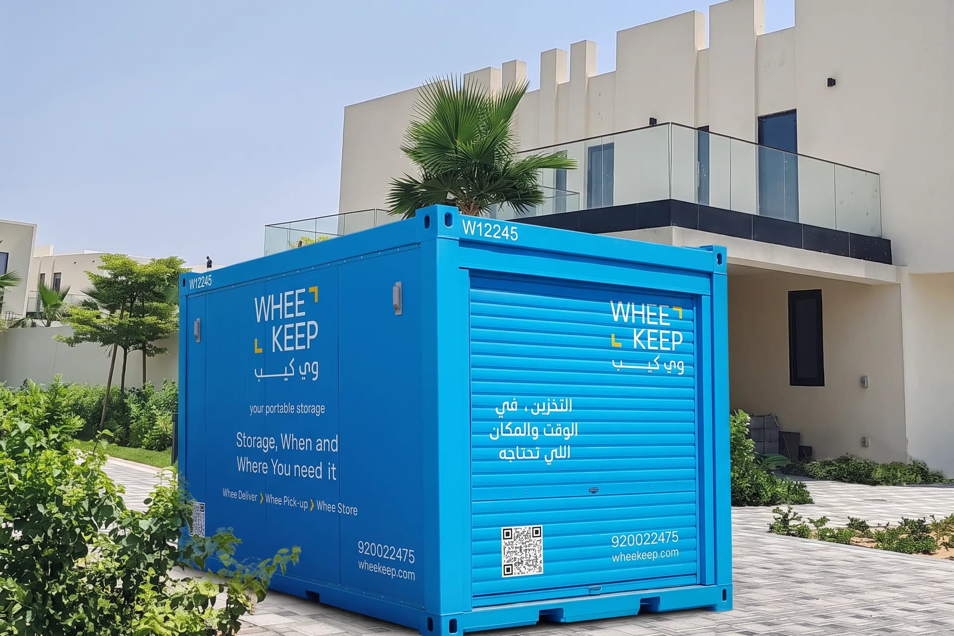 A WheeKeep storage unit outside a villa with palm trees